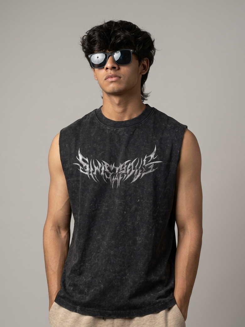 Person wearing a black sleeveless shirt with white text and sunglasses on a gray background